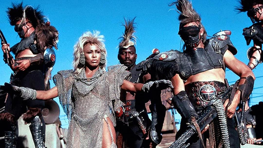 In The Road Warrior (Mad Max 2), the raiders wear dark and the good guys  wear light colors, except Max. He's the necessary evil that can deliver the  people from the wasteland. :